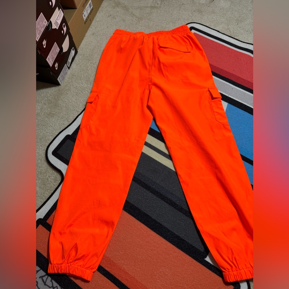 H&M neon orange cargo pants. Worn, no signs of wear. Too small size L Men.